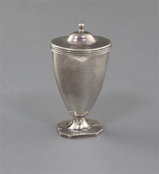 A George III silver vase shaped nutmeg grater, with hinged lid and base, 67mm.